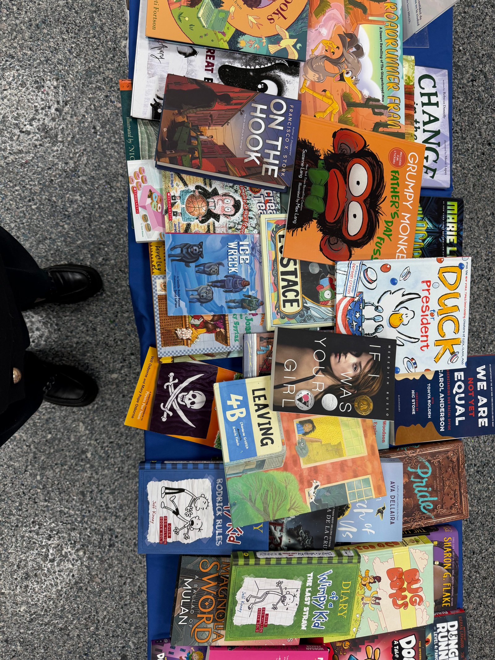 Reading books with kids at a Brooklyn Book Bodega free book event in an NYC shelter